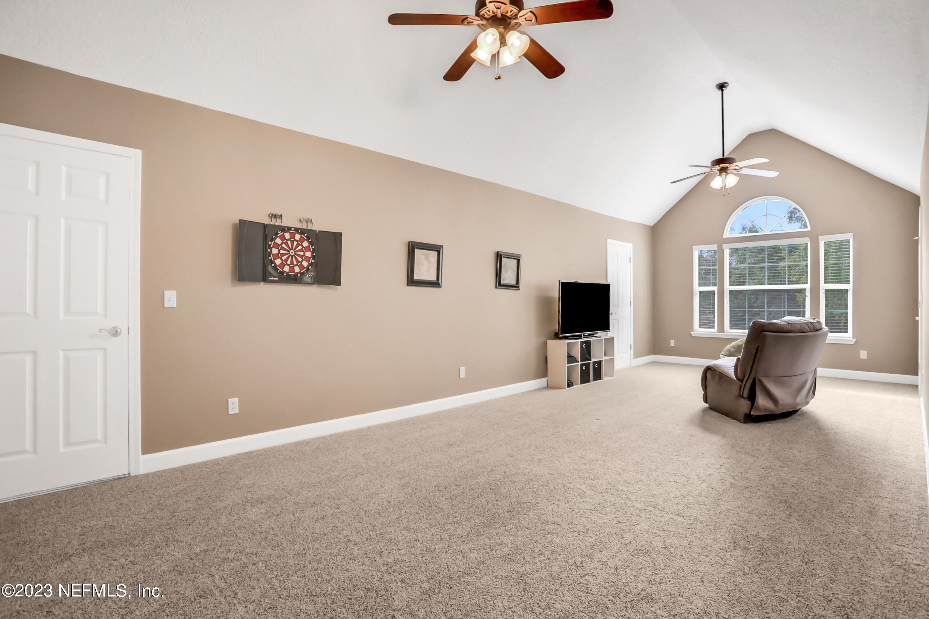 212 Twining Trace St. Johns, FL 32259 - Photo 30 of 60 a living room with furniture and a flat screen tv