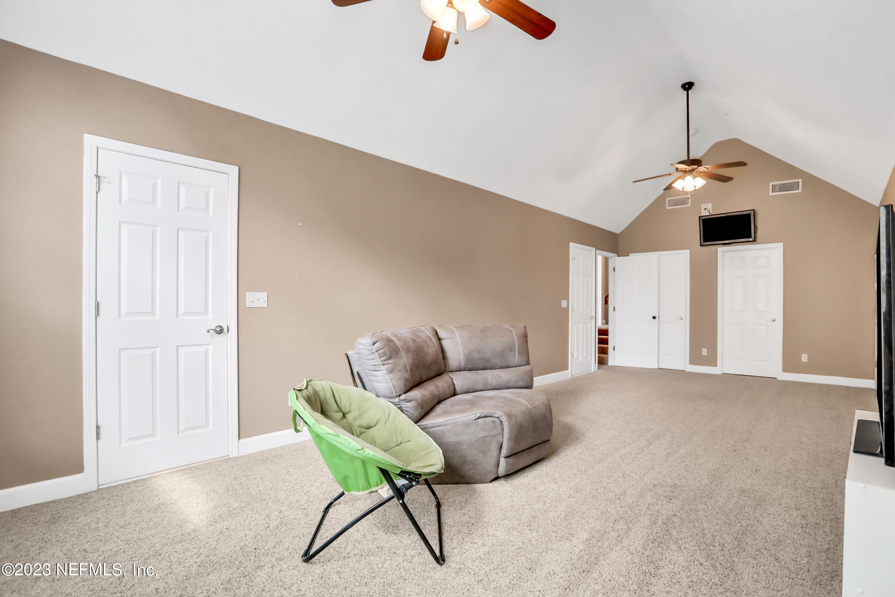 212 Twining Trace St. Johns, FL 32259 - Photo 31 of 60 a living room with furniture and a chandelier fan