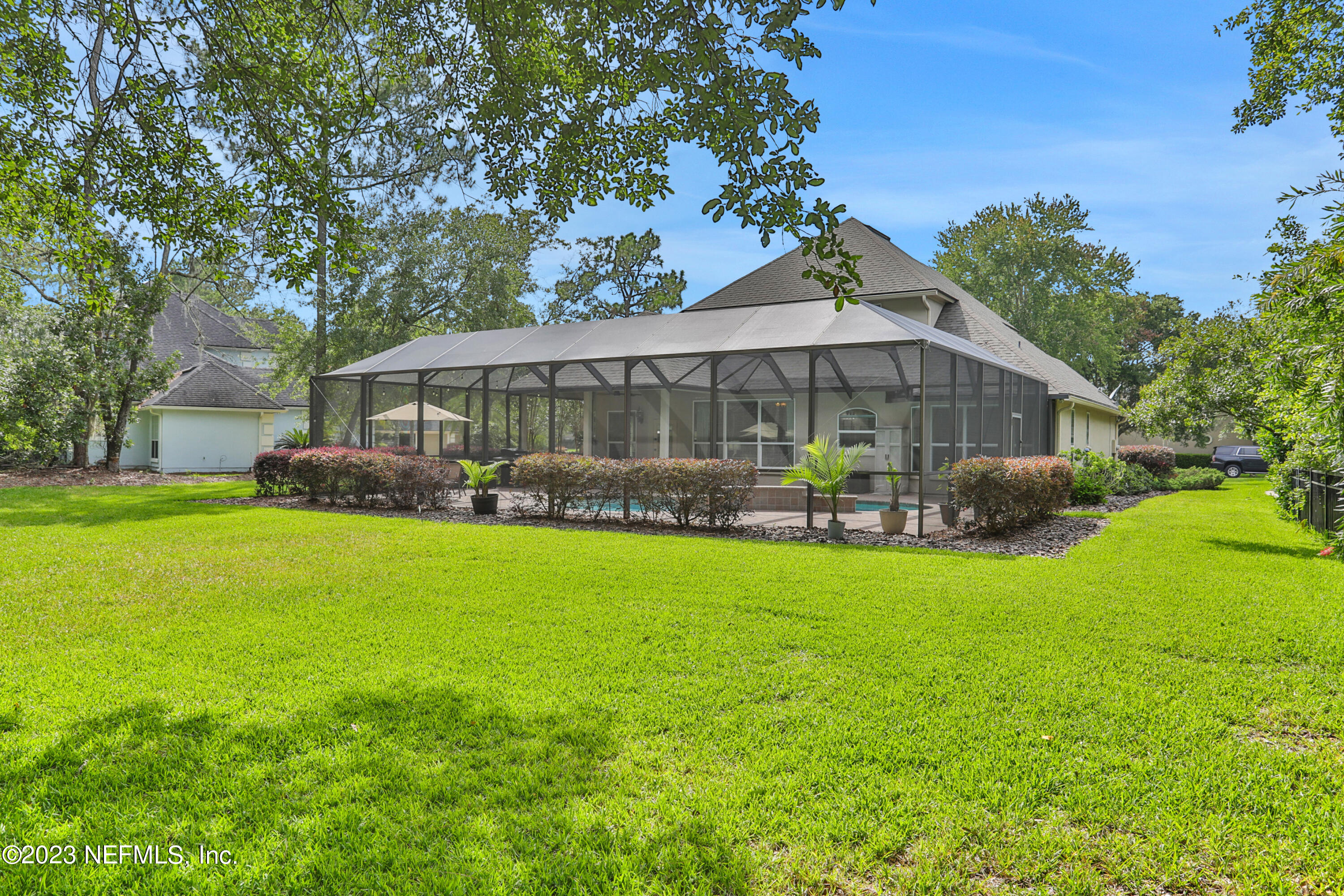 212 Twining Trace St. Johns, FL 32259 - Photo 37 of 60 a view of a house with a backyard and a patio