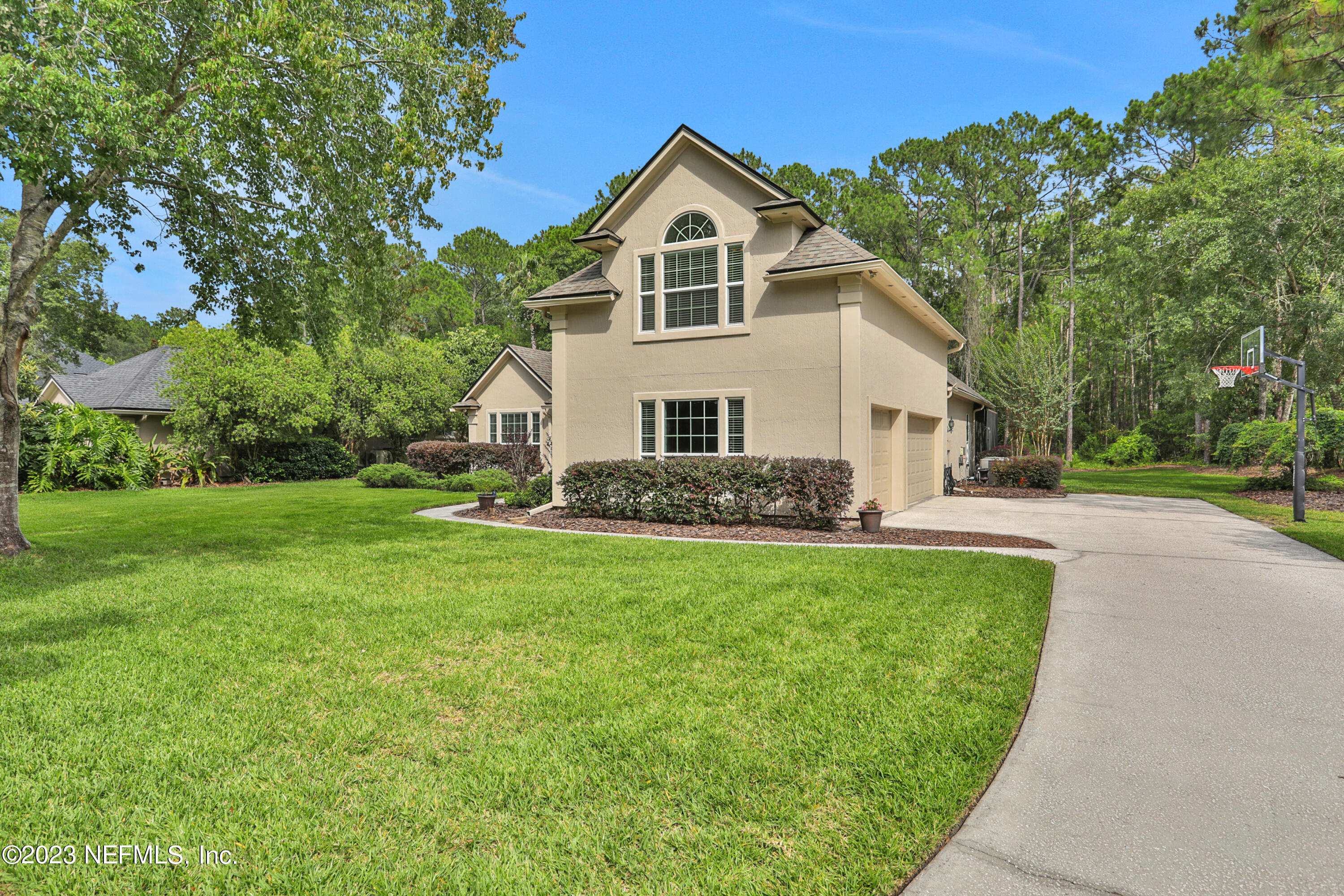 212 Twining Trace St. Johns, FL 32259 - Photo 40 of 60 a front view of a house with garden