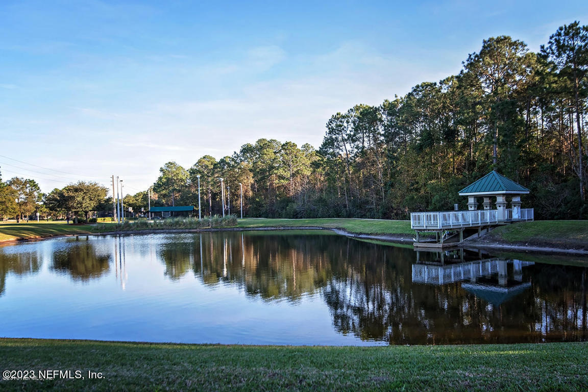 212 Twining Trace St. Johns, FL 32259 - Photo 56 of 60 a view of a lake with houses in the background