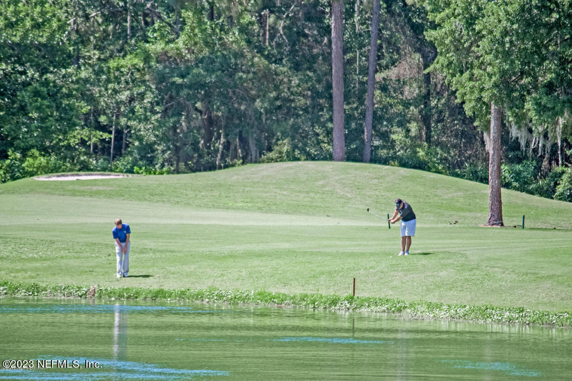 212 Twining Trace St. Johns, FL 32259 - Photo 58 of 60 a view of a golf area with green space