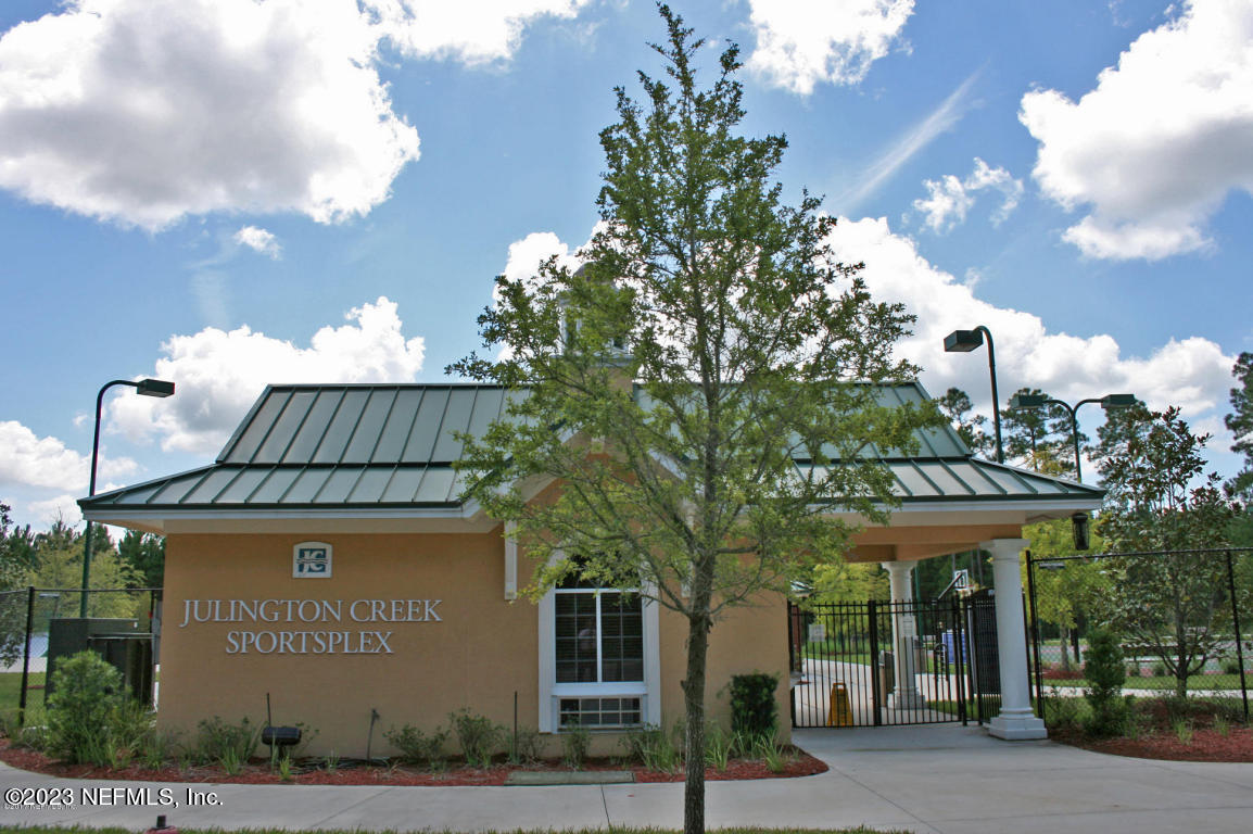 212 Twining Trace St. Johns, FL 32259 - Photo 59 of 60 a front view of a house with garden