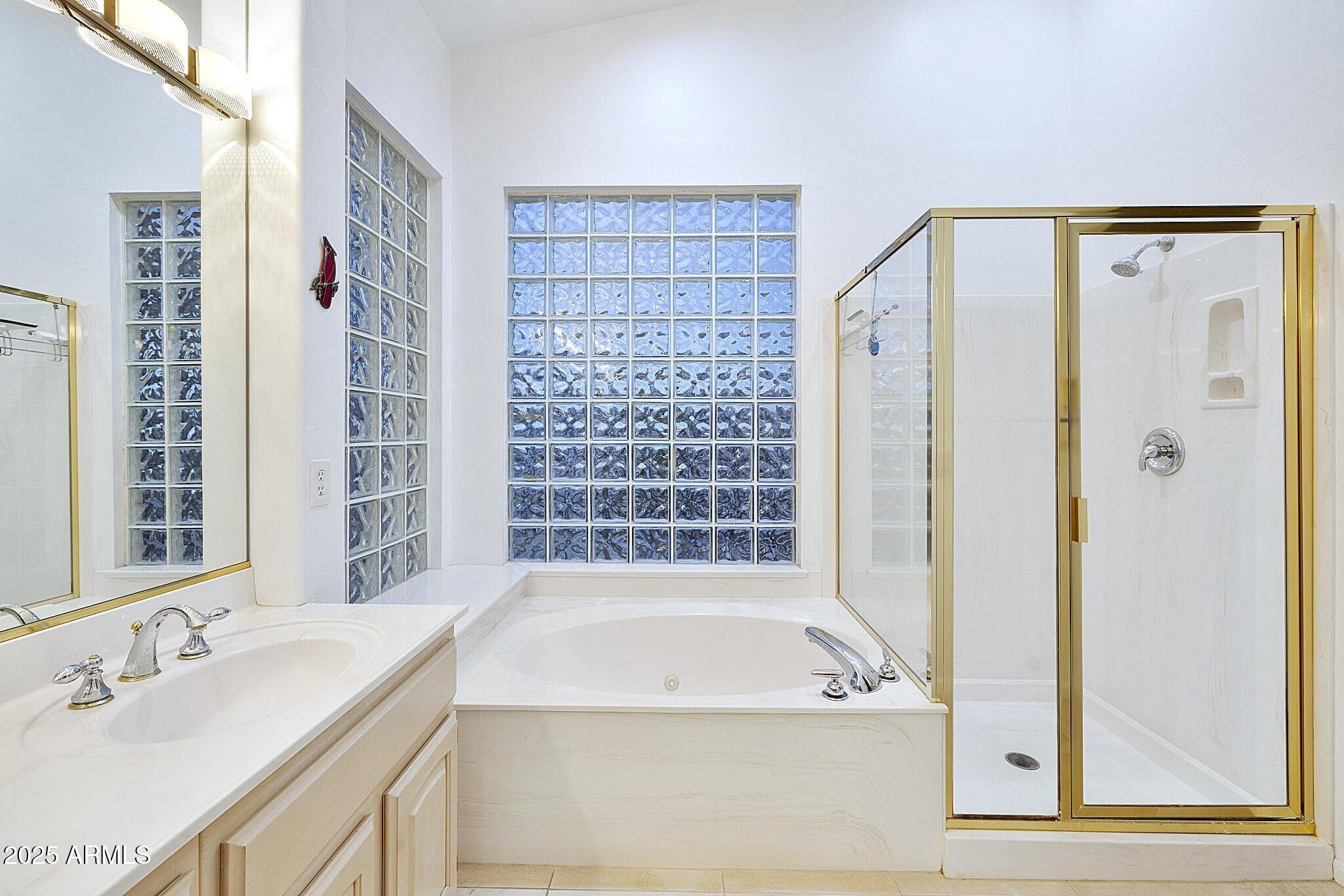 6334 East Viewmont Drive, Unit 57 Mesa, AZ 85215 - Photo 13 of 61 a bathroom with a bathtub and a sink