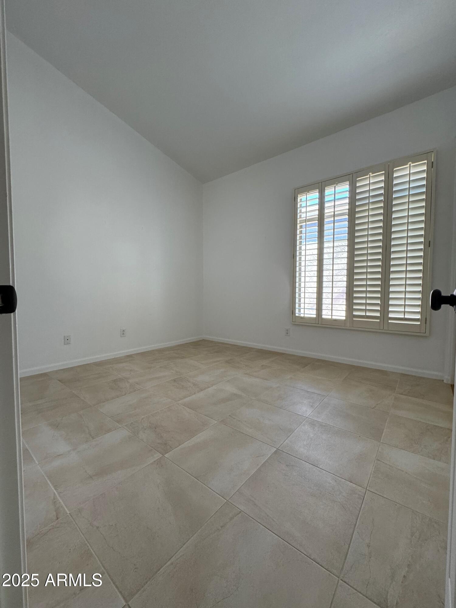 6334 East Viewmont Drive, Unit 57 Mesa, AZ 85215 - Photo 16 of 61 a view of an empty room with a window