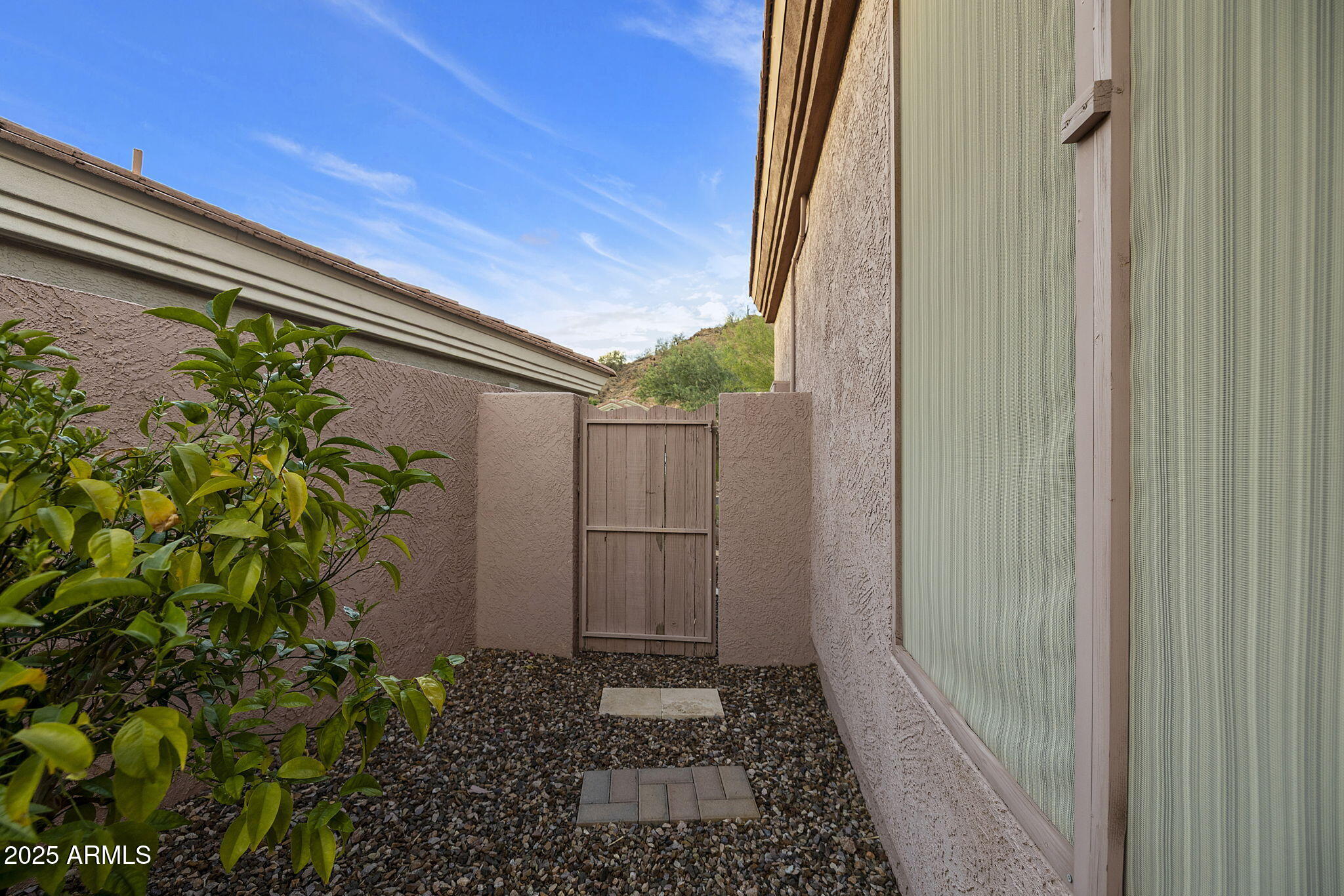 6334 East Viewmont Drive, Unit 57 Mesa, AZ 85215 - Photo 24 of 61 a house with a flower garden in front of it