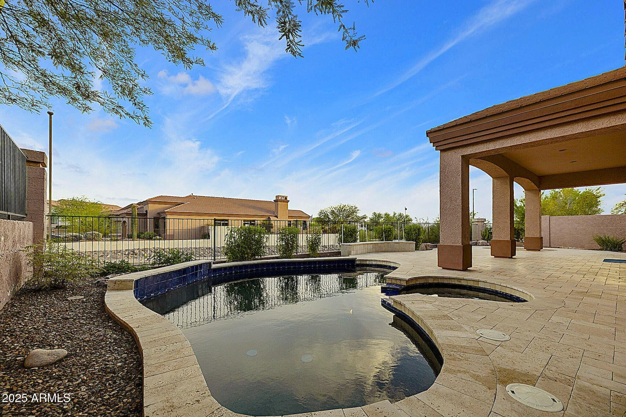 6334 East Viewmont Drive, Unit 57 Mesa, AZ 85215 - Photo 32 of 61 a view of a swimming pool with a patio