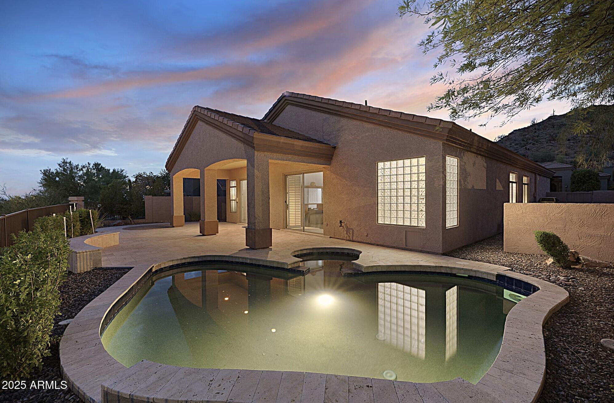 6334 East Viewmont Drive, Unit 57 Mesa, AZ 85215 - Photo 35 of 61 a view of a house with swimming pool and sitting area
