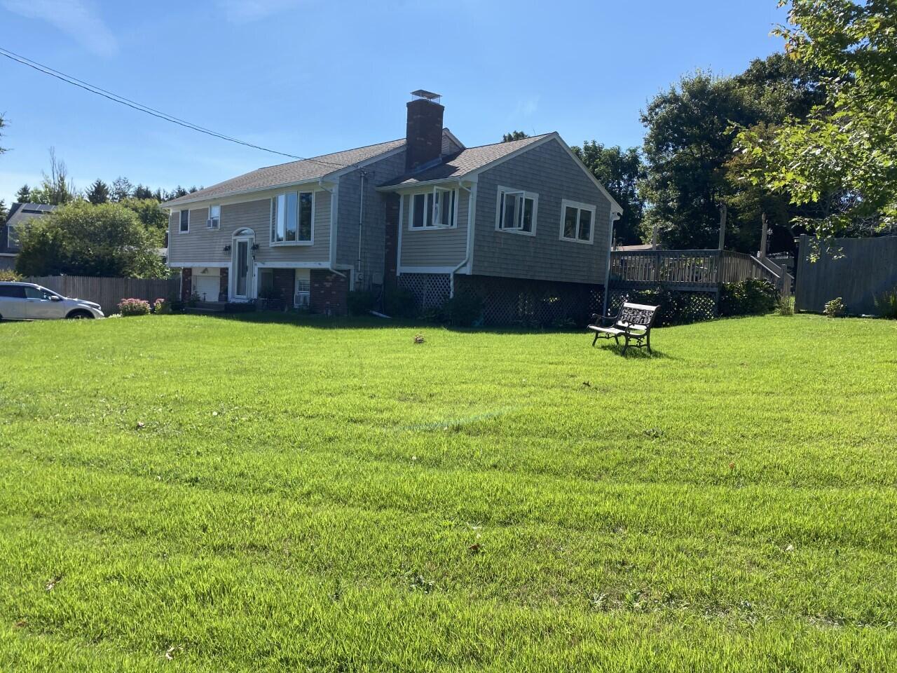 46 Diandy Road Sagamore Beach, MA 02562 - Photo 1 of 23 a front view of a house with a yard