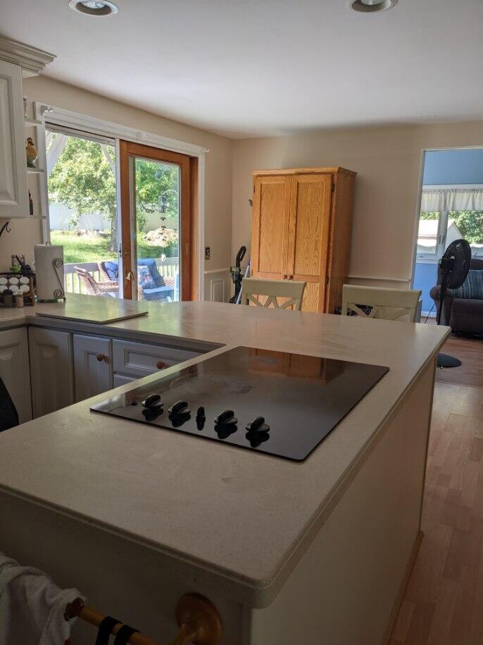 46 Diandy Road Sagamore Beach, MA 02562 - Photo 7 of 23 a kitchen with a sink a counter top space and a window