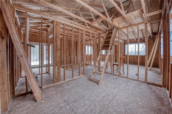 a view of an empty room with a staircase