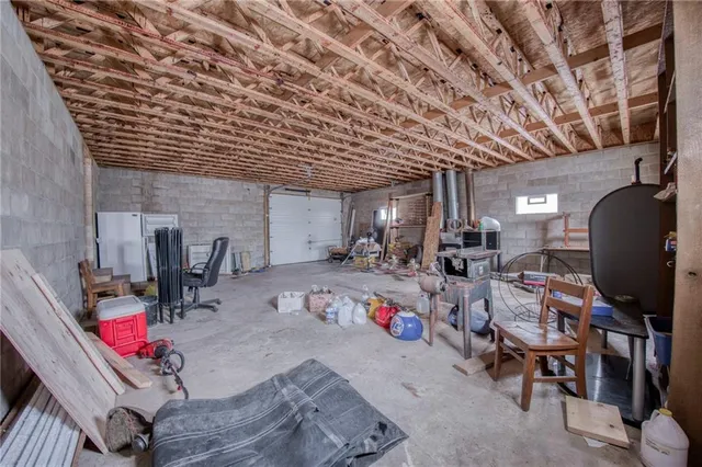 a room with gym equipment and a chandelier