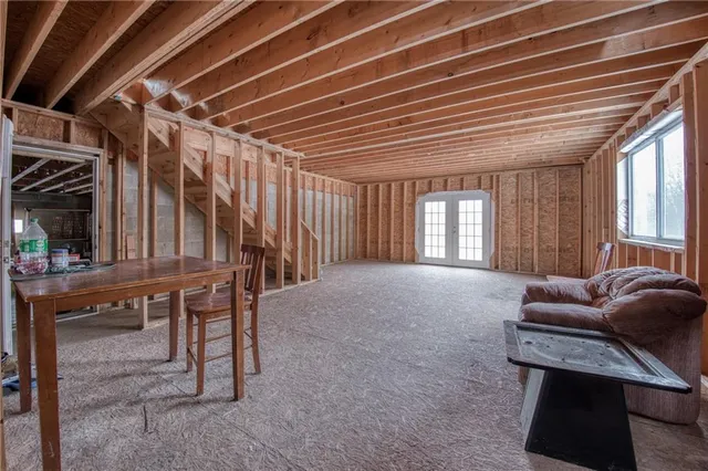 a livingroom with furniture and window