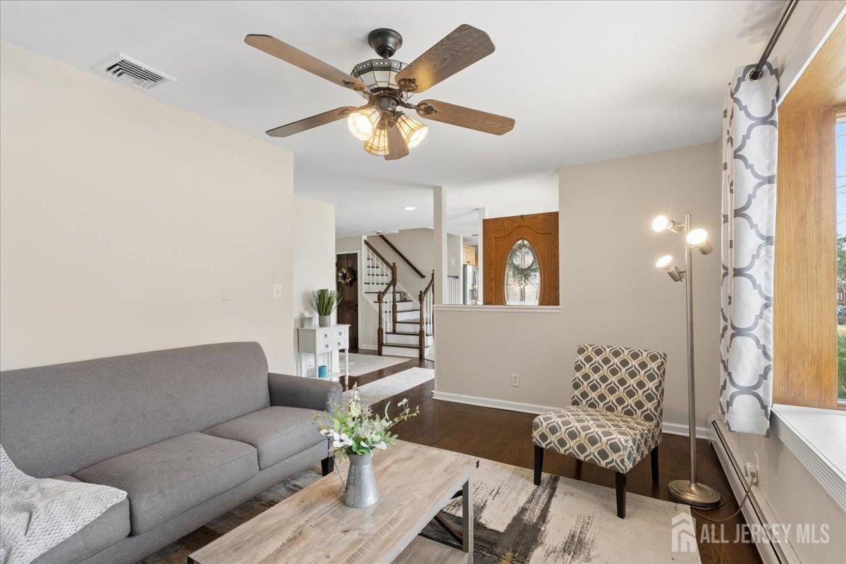 45 Walnut Street Edison, NJ 08817 - Photo 5 of 28 a living room with furniture and a chandelier
