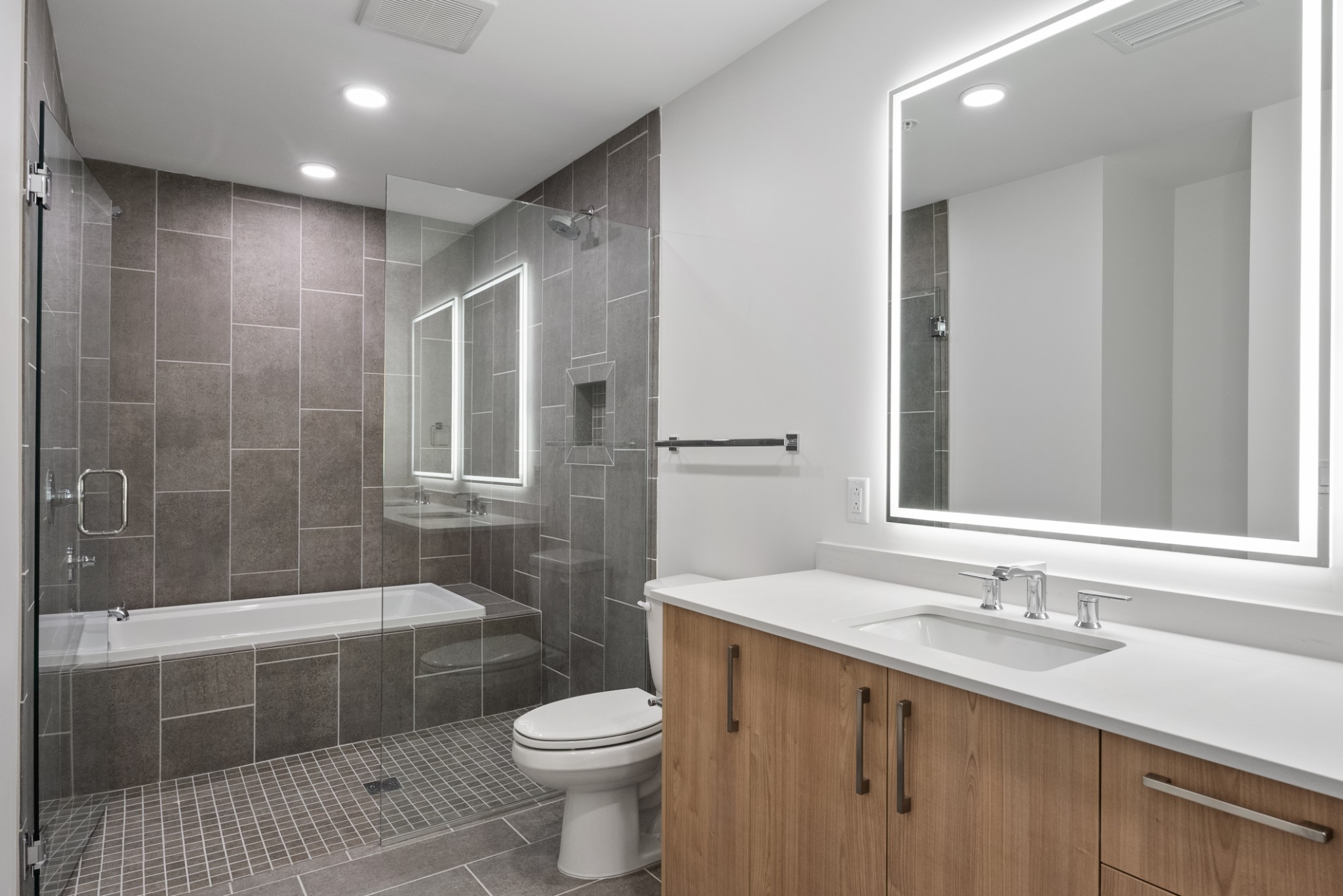 1212 Demonbreun Street, Unit C3D(K) Nashville, TN 37203 - Photo 15 of 33 a bathroom with a sink a toilet and shower