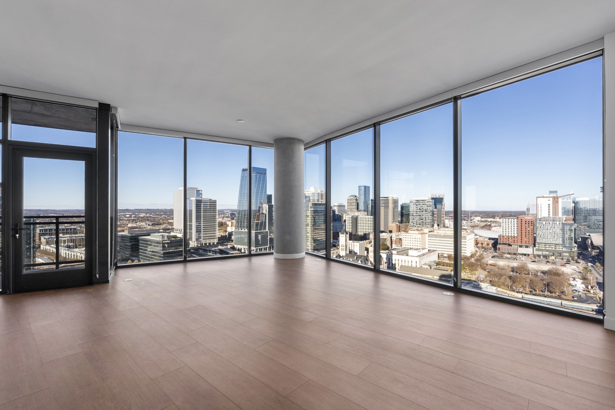 1212 Demonbreun Street, Unit C3D(K) Nashville, TN 37203 - Photo 8 of 33 a view of an empty room window and a wooden floor