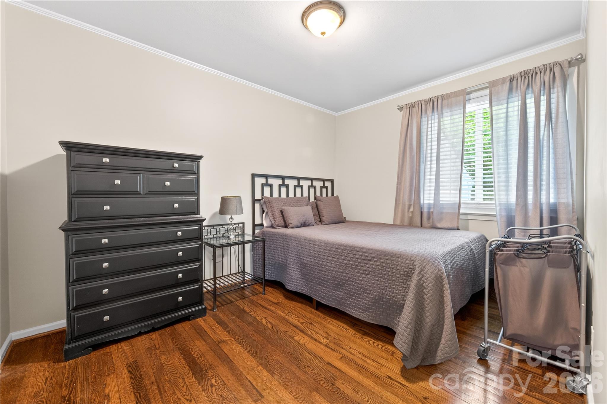 3241 Minnesota Road Charlotte, NC 28208 - Photo 14 of 18 a bedroom with a bed and window