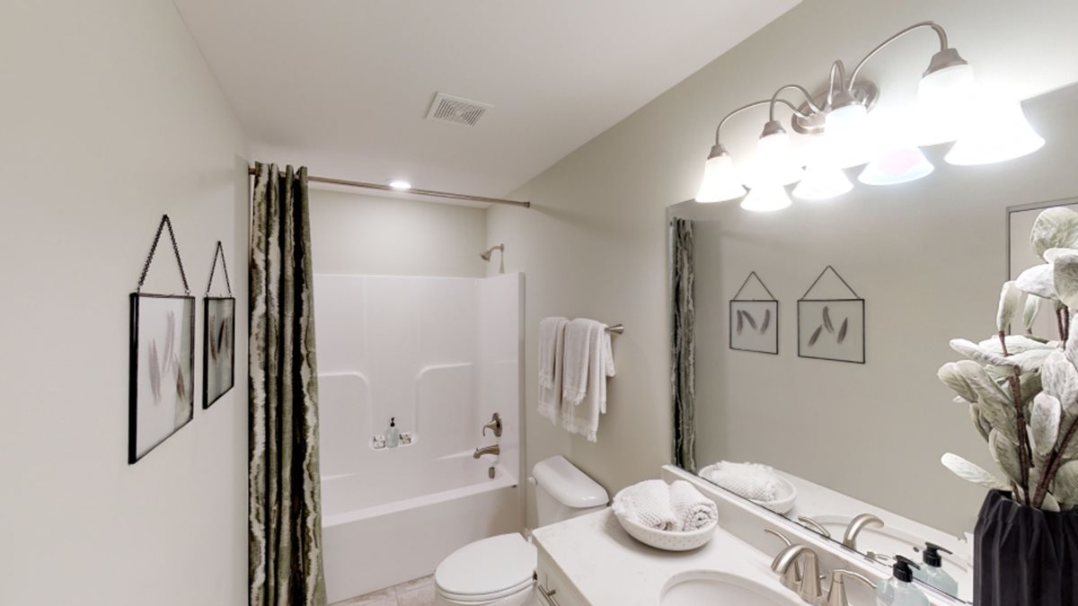 229 Bowers Street Elburn, IL 60119 - Photo 9 of 11 a bathroom with a sink a toilet and shower