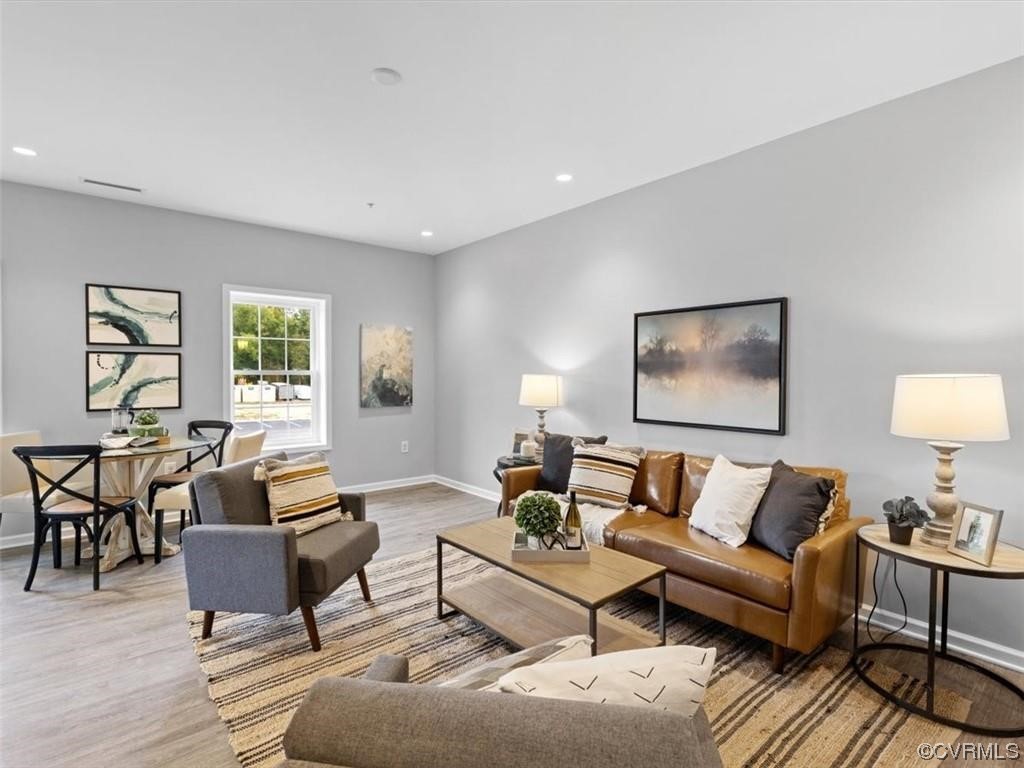 1504 Ewing Park Loop, Unit 205 Midlothian, VA 23113 - Photo 7 of 26 a living room with furniture and a wooden floor