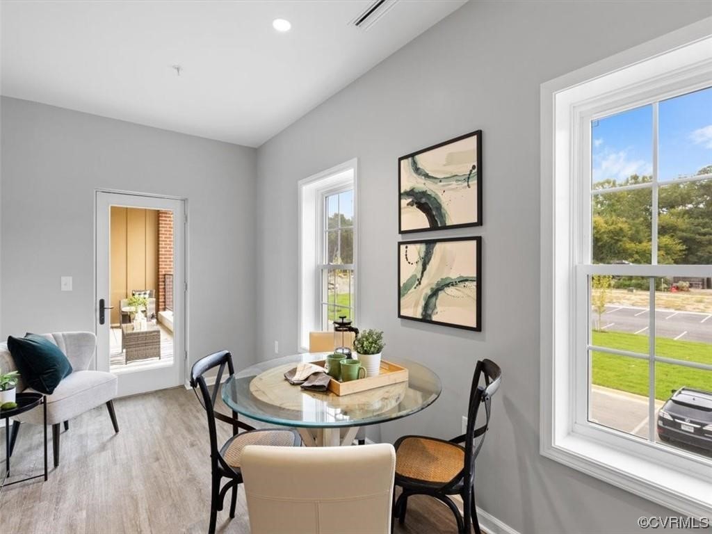 1504 Ewing Park Loop, Unit 205 Midlothian, VA 23113 - Photo 10 of 26 a dining room with furniture and window