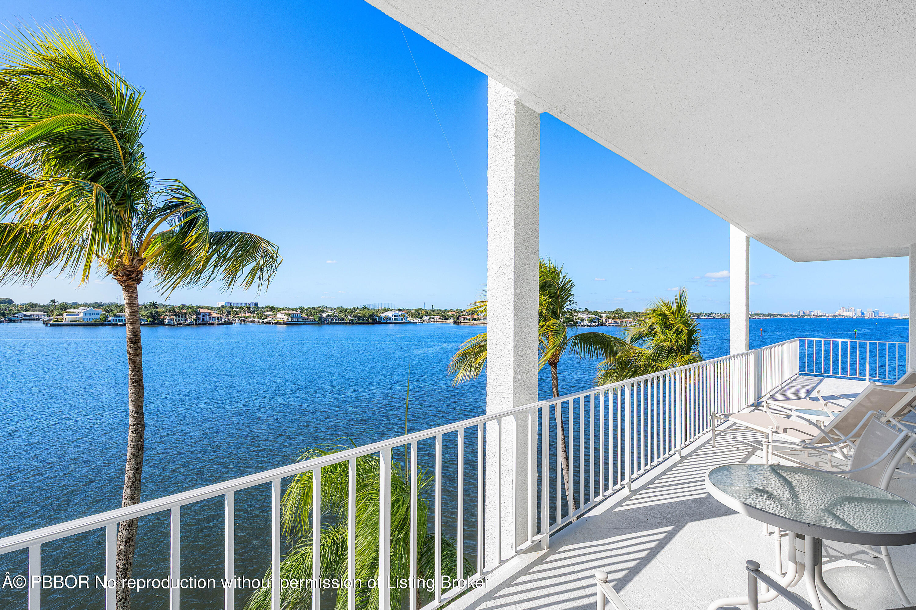 a view of a balcony with floor to ceiling window and wooden floor