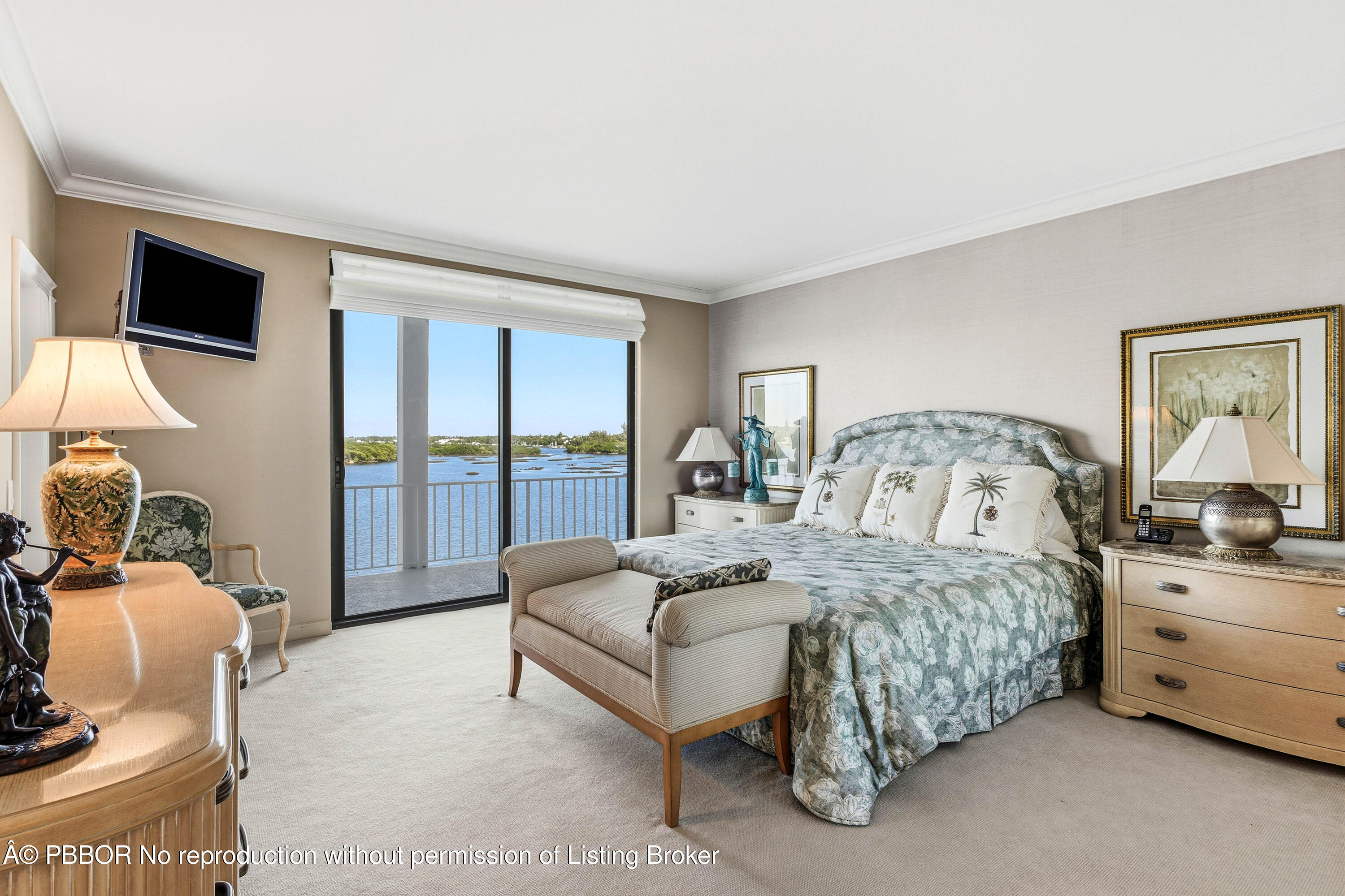 2150 Ibis Isle Road, Unit 15 Palm Beach, FL 33480 - Photo 20 of 47 a bedroom with a bed and large window