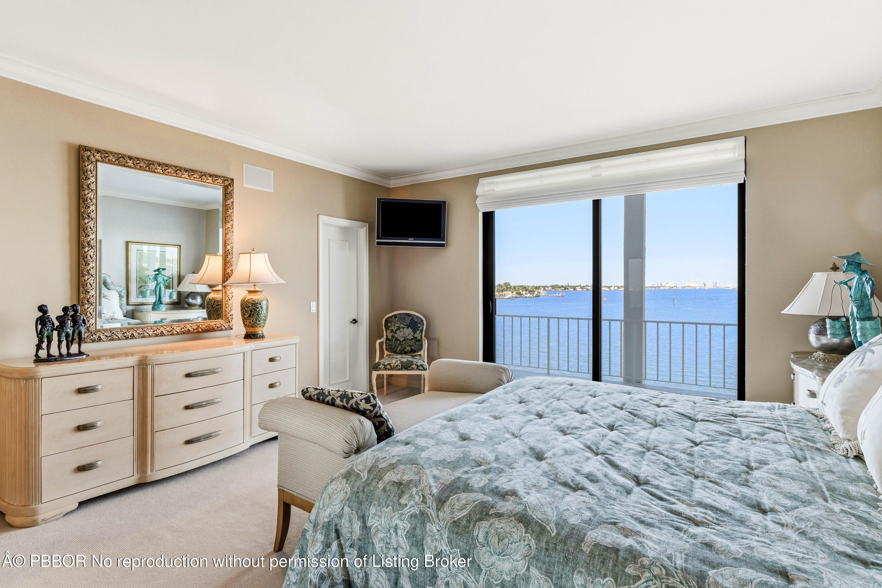 2150 Ibis Isle Road, Unit 15 Palm Beach, FL 33480 - Photo 21 of 47 a bedroom with a large bed and a dresser