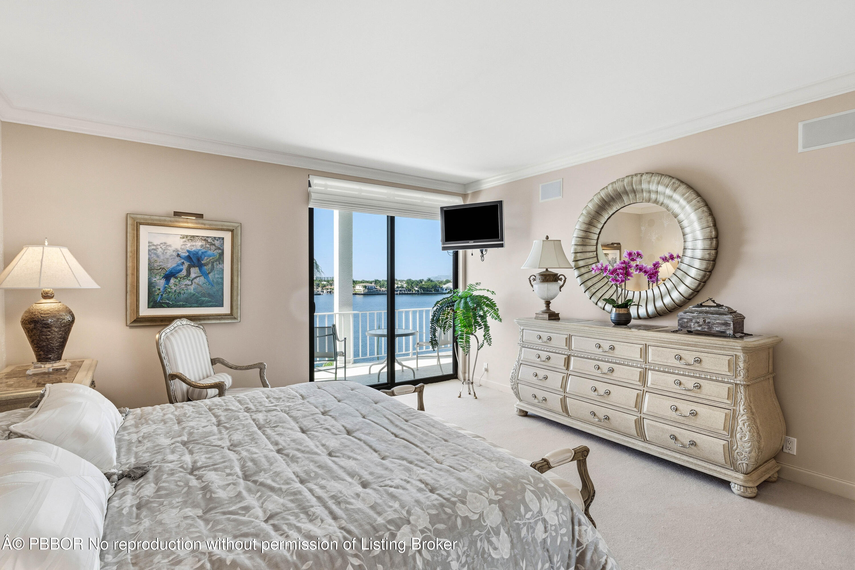 2150 Ibis Isle Road, Unit 15 Palm Beach, FL 33480 - Photo 25 of 47 a bedroom with a bed and a dresser