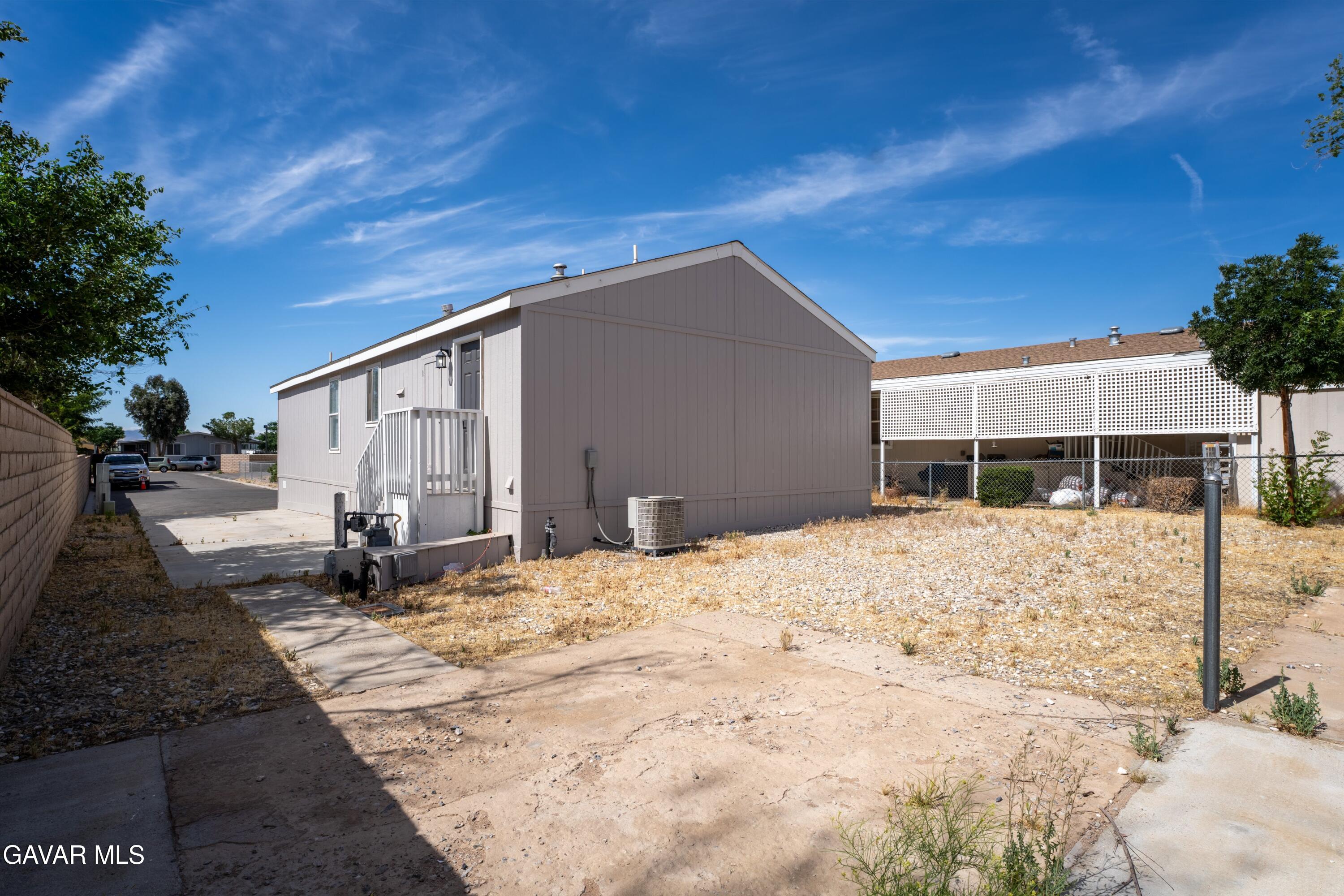 20843 Waalew Road Apple Valley, CA 92307 - Photo 22 of 40 a front view of a house with a yard