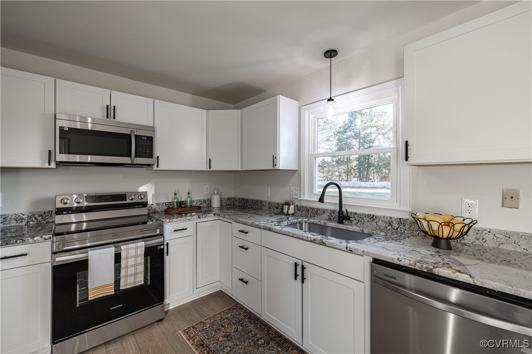 5501 West Quaker Road Disputanta, VA 23842 - Photo 14 of 26 Kitchen featuring stainless steel appliances, wood