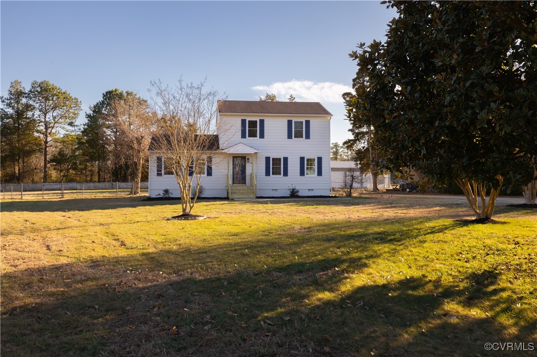 5501 West Quaker Road Disputanta, VA 23842 - Photo 2 of 26 View of front of house with a front lawn, crawl sp