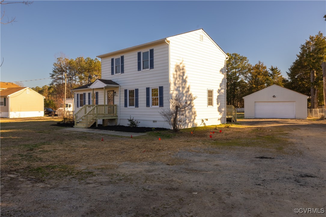 5501 West Quaker Road Disputanta, VA 23842 - Photo 4 of 26 View of front facade with crawl space, a detached