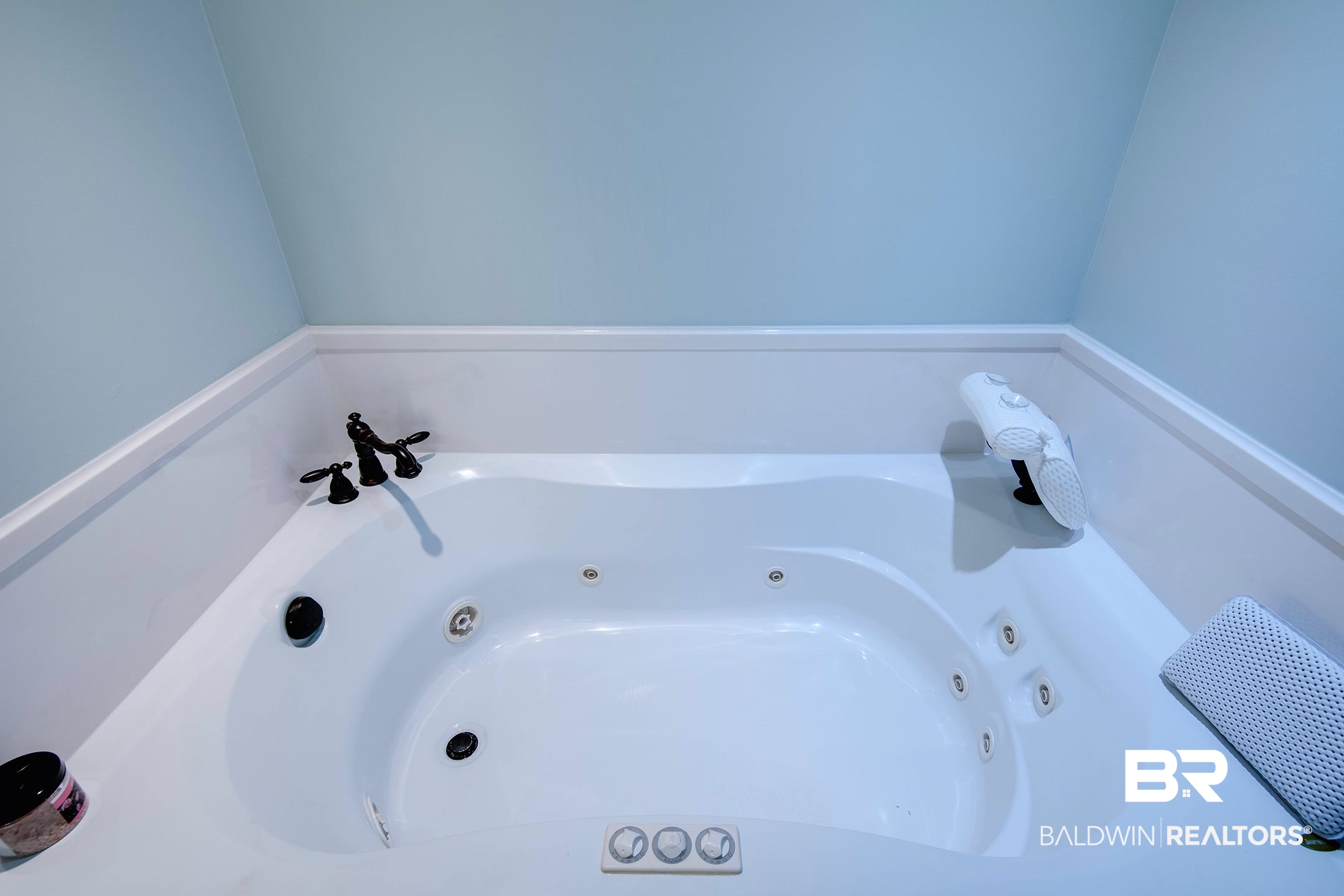 9357 Lakeview Drive Foley, AL 36535 - Photo 61 of 68 Built-in jetted tub featuring a white finish, dark bronze hardware, and light blue wall paint