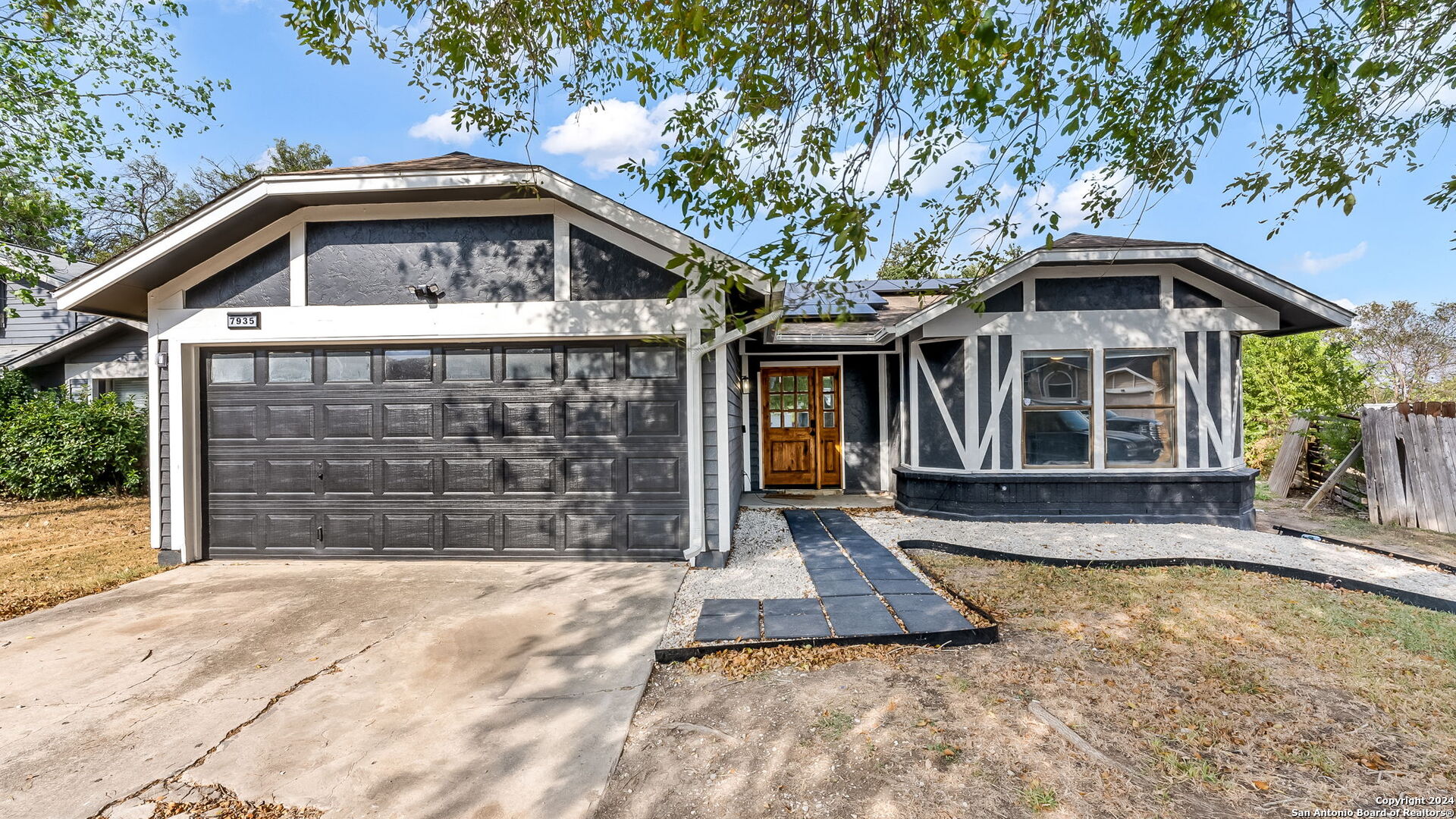 7935 Sonny Ridge San Antonio, TX 78244 - Photo 1 of 22 a front view of a house with a yard and garage