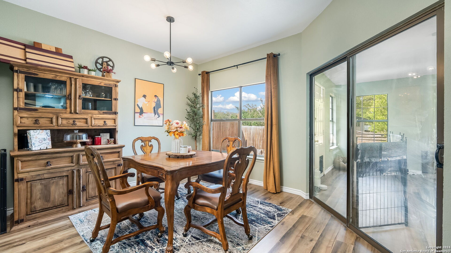 7935 Sonny Ridge San Antonio, TX 78244 - Photo 12 of 22 a view of a dining room with furniture window and wooden floor