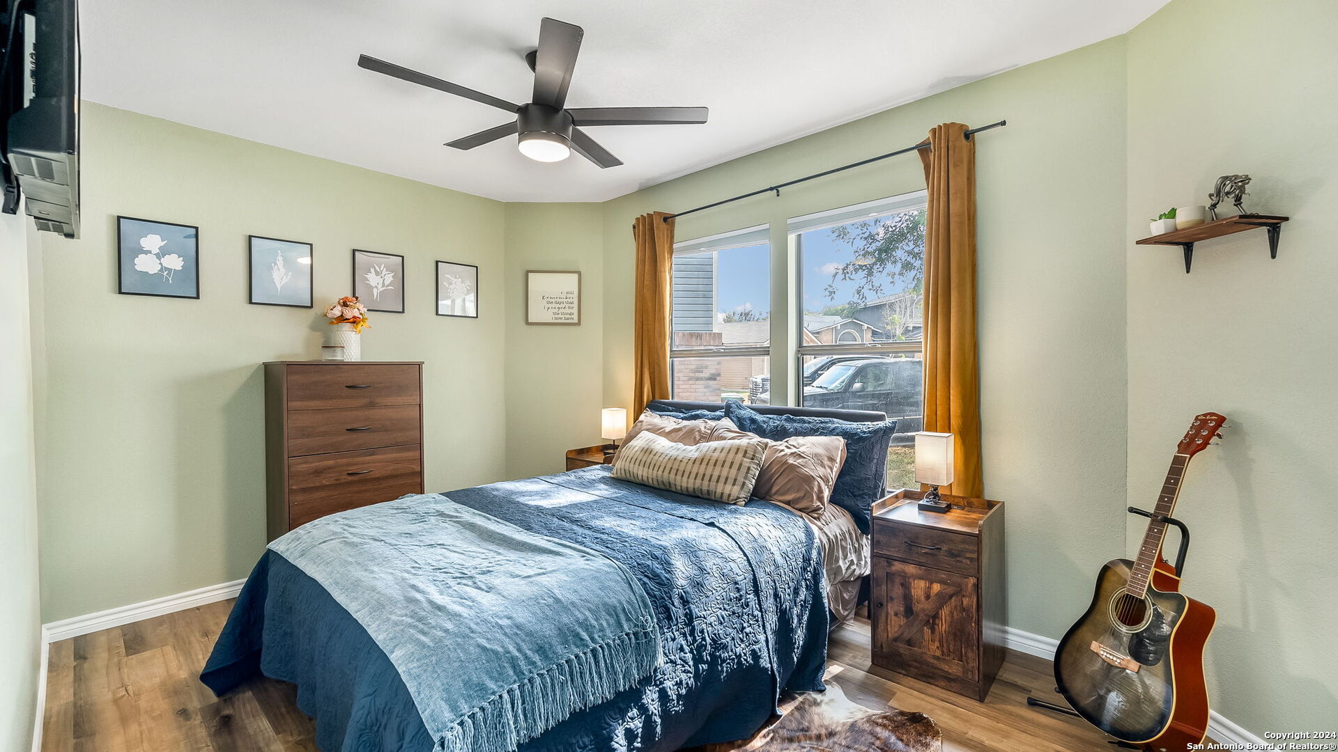 7935 Sonny Ridge San Antonio, TX 78244 - Photo 14 of 22 a bedroom with a bed dresser and a window