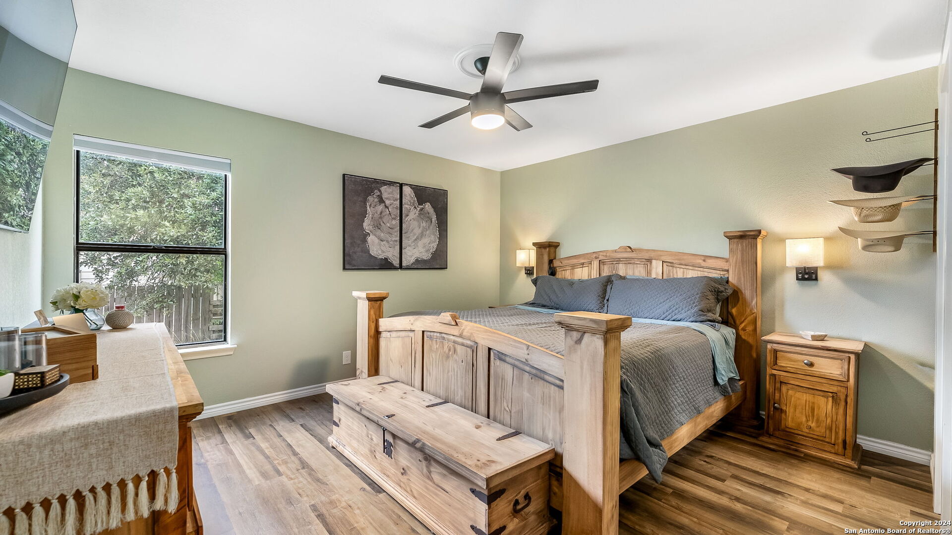 7935 Sonny Ridge San Antonio, TX 78244 - Photo 17 of 22 a bedroom with a bed and wooden floor