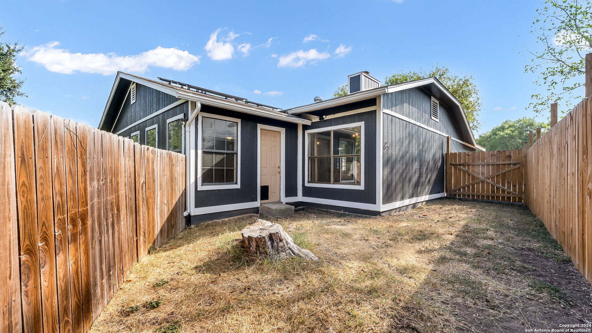 7935 Sonny Ridge San Antonio, TX 78244 - Photo 21 of 22 a view of house with backyard and wooden fence