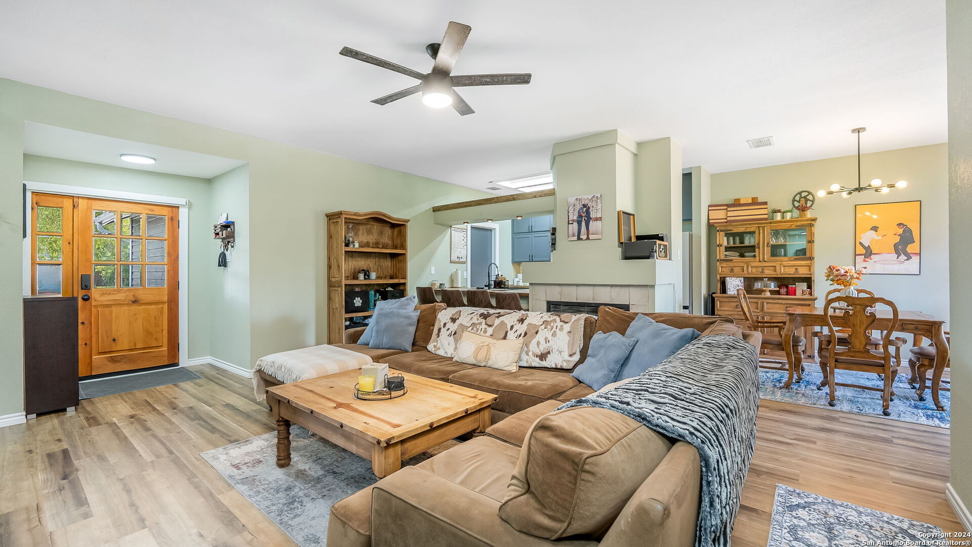 7935 Sonny Ridge San Antonio, TX 78244 - Photo 5 of 22 a living room with furniture a ceiling fan and a rug