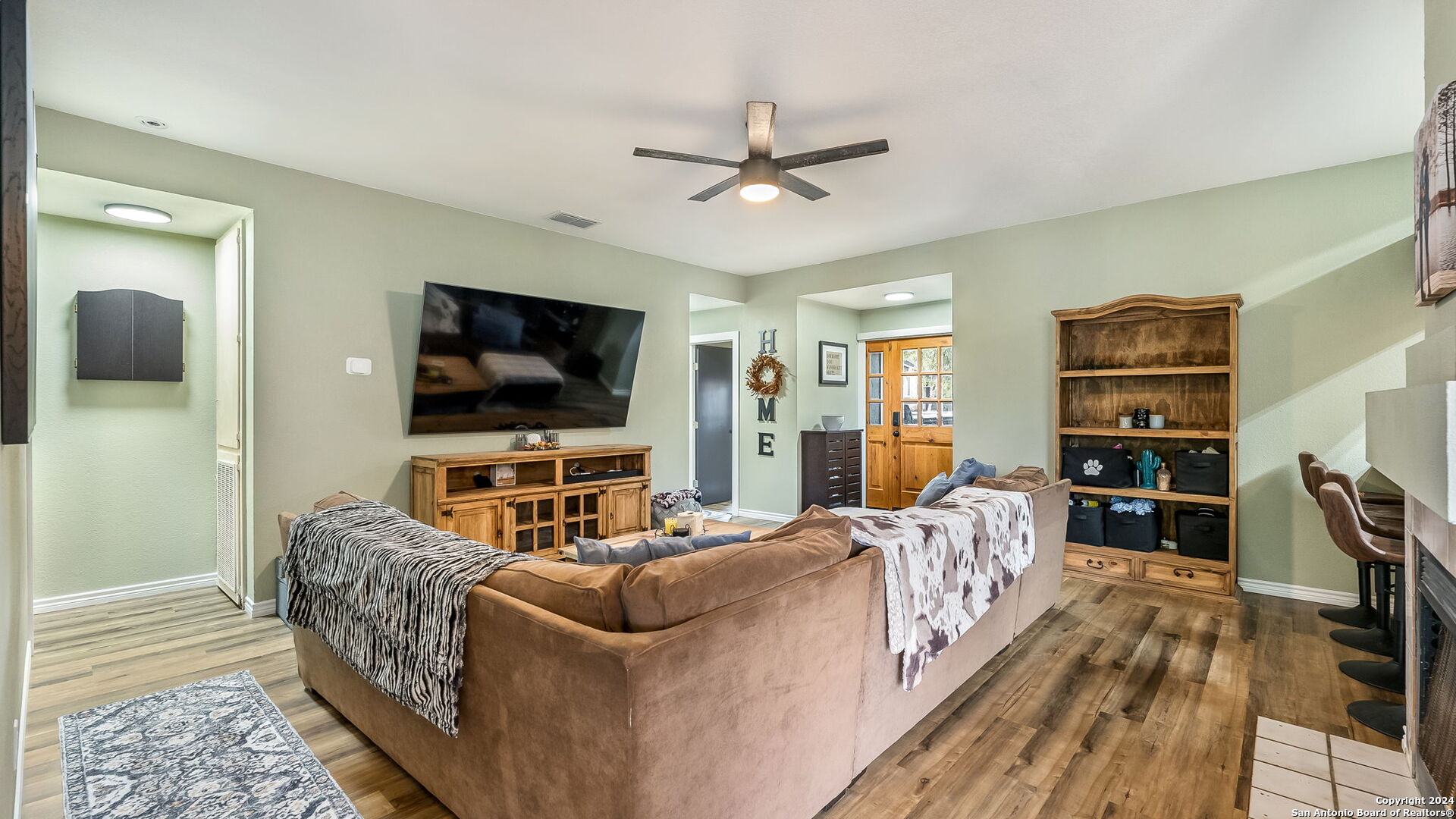 7935 Sonny Ridge San Antonio, TX 78244 - Photo 6 of 22 a living room with furniture and a flat screen tv