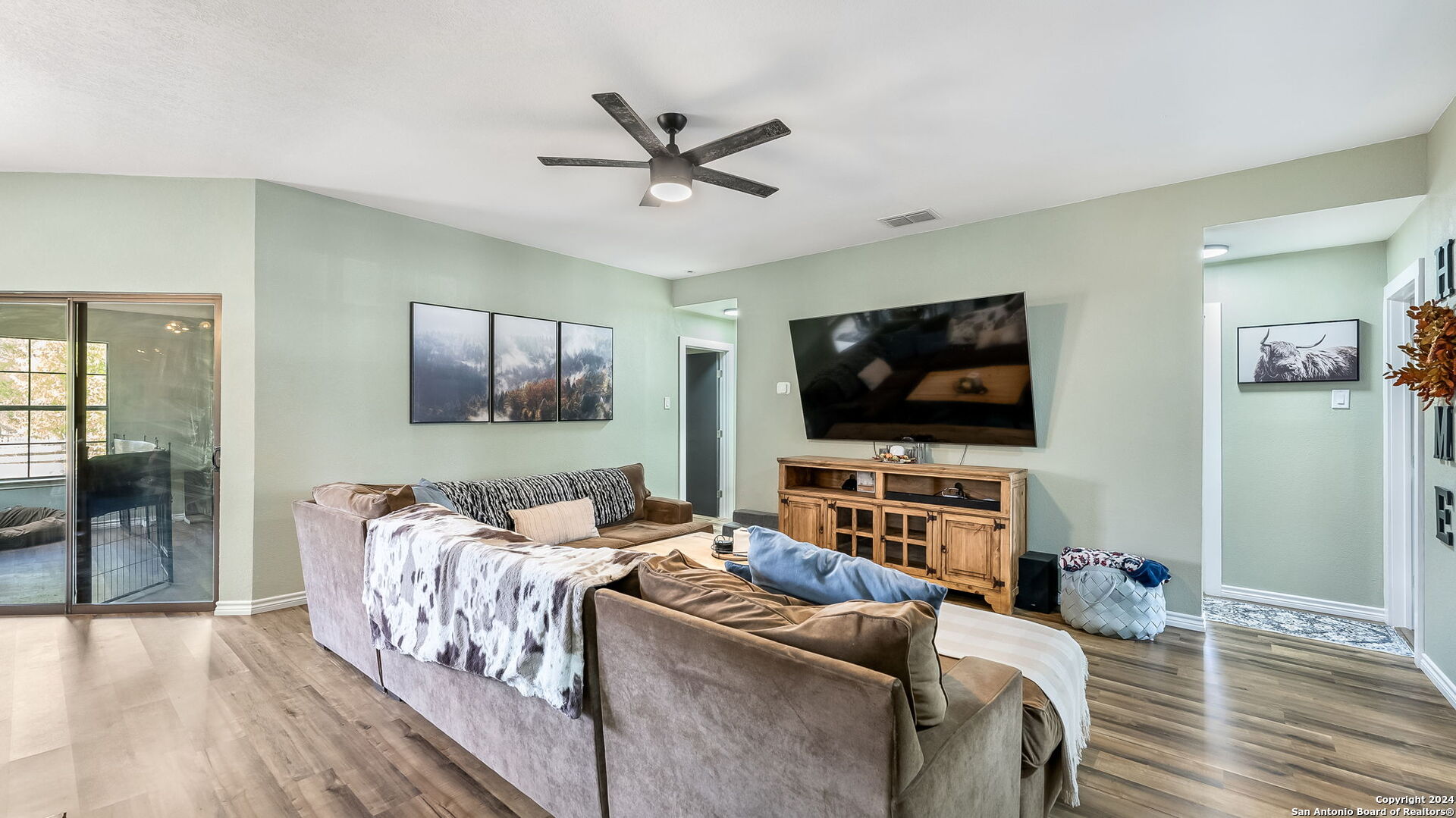 7935 Sonny Ridge San Antonio, TX 78244 - Photo 7 of 22 a living room with furniture and a flat screen tv