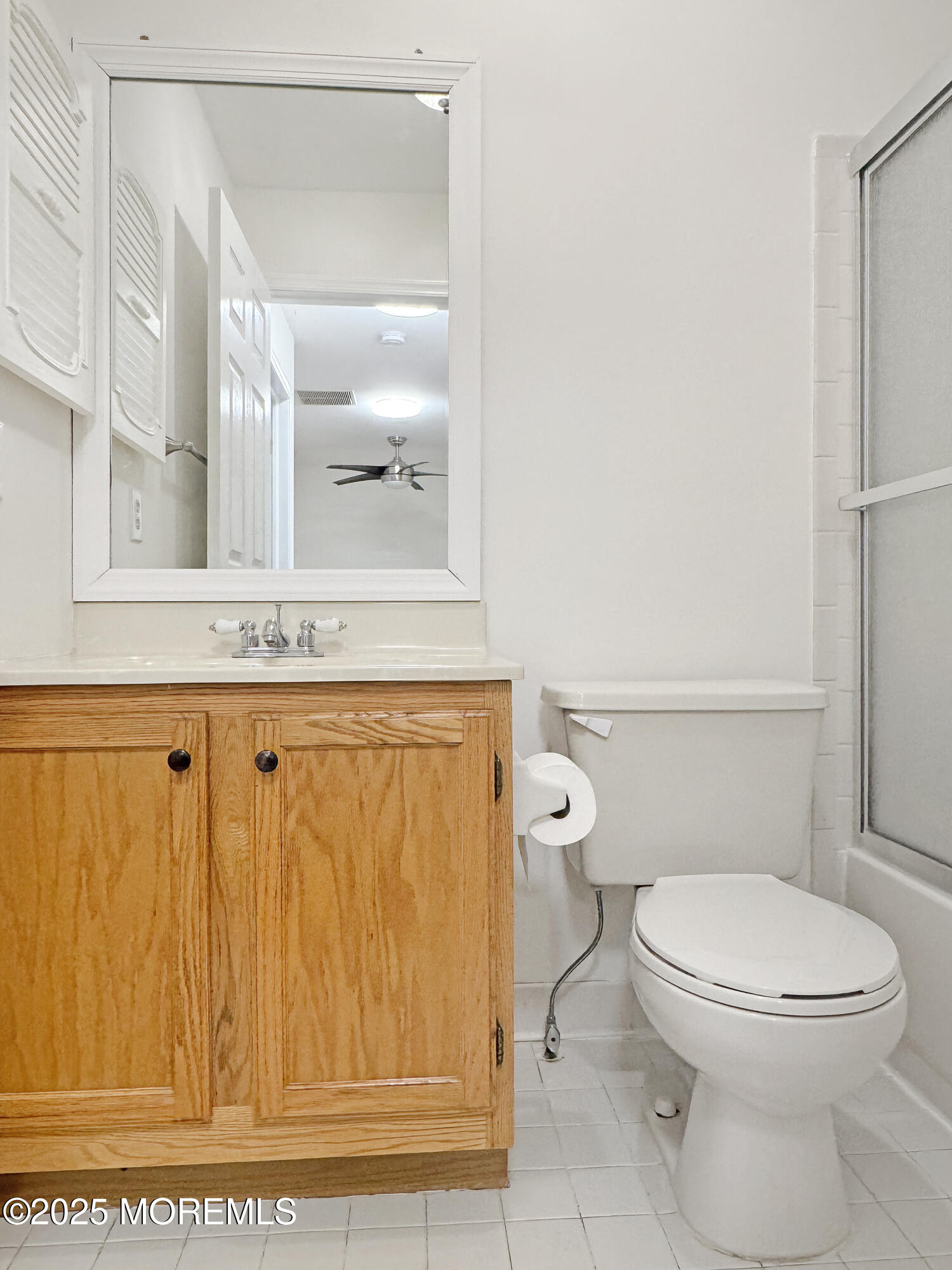 577 Windflower Court Morganville, NJ 07751 - Photo 16 of 27 a bathroom with a granite countertop window and a toilet