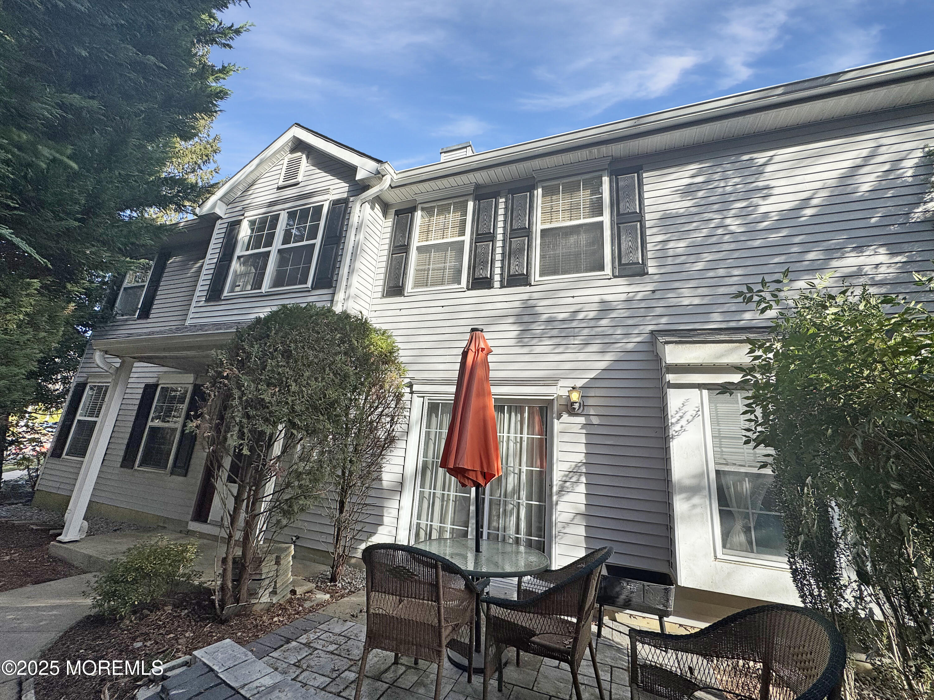 577 Windflower Court Morganville, NJ 07751 - Photo 2 of 27 a front view of a house with a yard