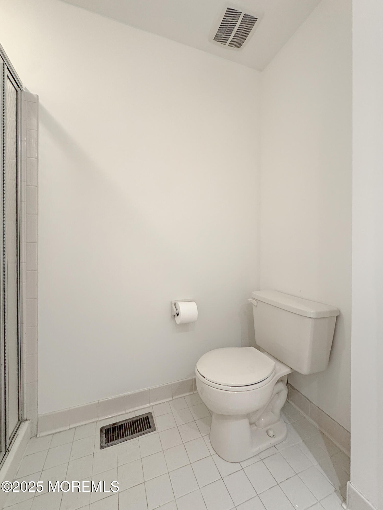 577 Windflower Court Morganville, NJ 07751 - Photo 23 of 27 a white toilet sitting next to a white sink