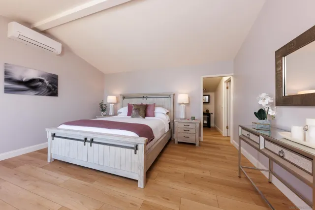 a bedroom with a bed and a walk in closet