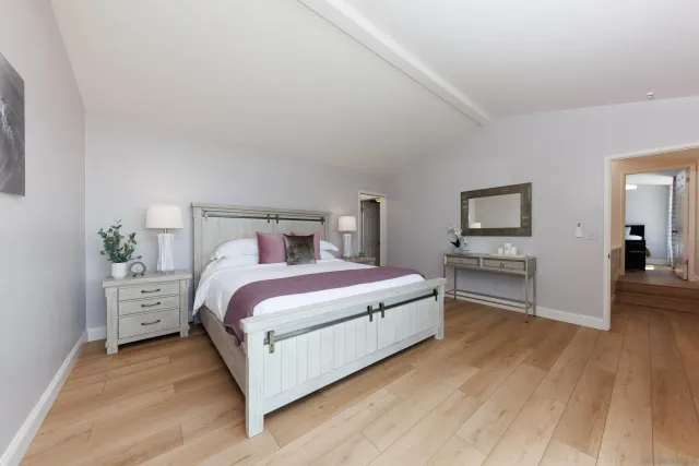 a bed room with a bed and a tv