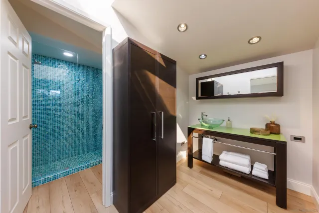 a bathroom with a toilet and shower