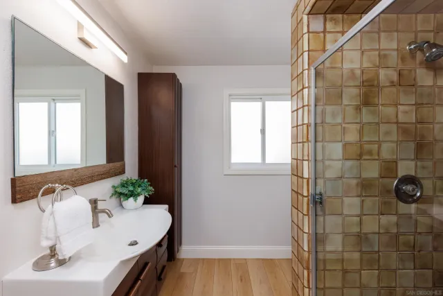 a bedroom with a large bed and a large window