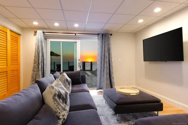 a bedroom with a bed and a night stand