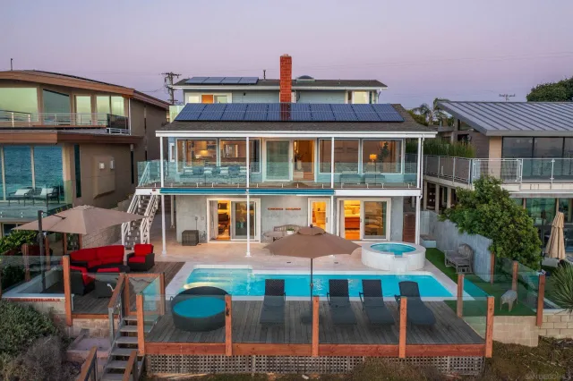a view of a swimming pool with outdoor seating